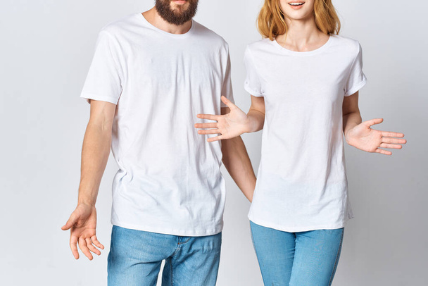 young couple in white t-shirts and jeans Design mockup Copy Space - Foto, immagini