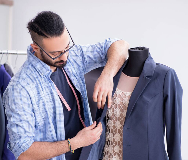 Male tailor working in the workshop on new designs - Zdjęcie, obraz