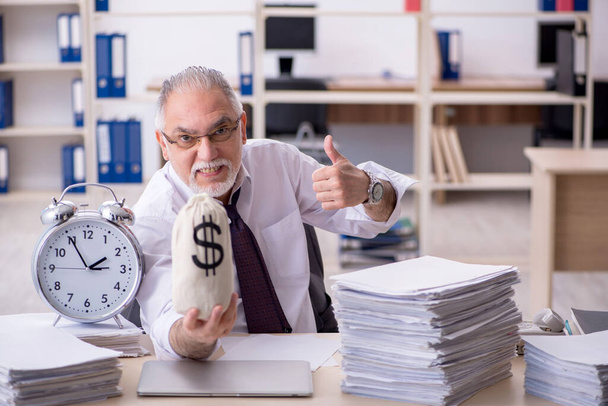Old male employee in time management concept - Photo, Image