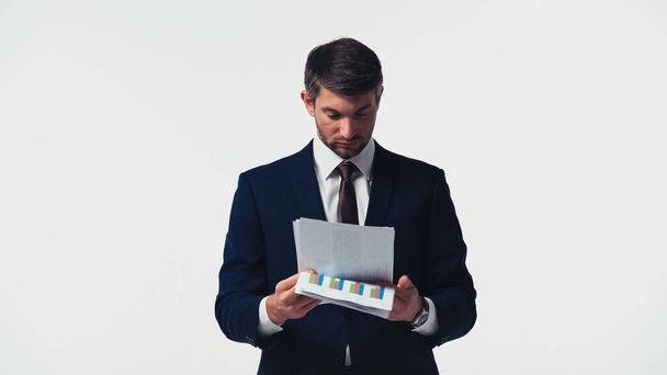 Podnikatel drží papíry s grafy izolované na bílém - Fotografie, Obrázek