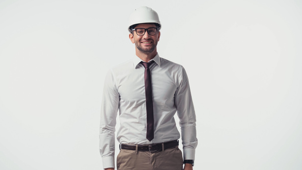 Smiling engineer in safety helmet looking at camera isolated on white - Φωτογραφία, εικόνα