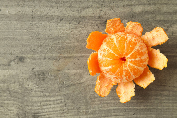 Tasty fresh mandarin on grey textured table - Φωτογραφία, εικόνα