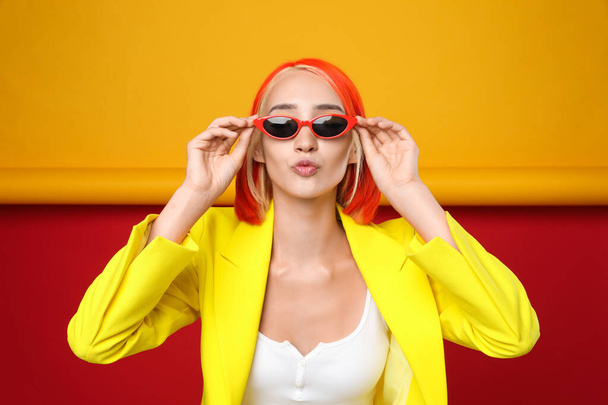 Beautiful young woman with bright dyed hair on color background - Φωτογραφία, εικόνα