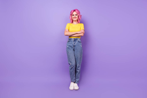 Full length photo of young girl happy positive smile confident crossed hands isolated over violet color background - Φωτογραφία, εικόνα