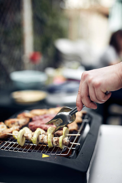 Preparing barbeque on a electrical modern grill outdoors. - Photo, Image