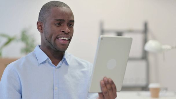Online Video Chat on Tablet by African Man  - Fotoğraf, Görsel