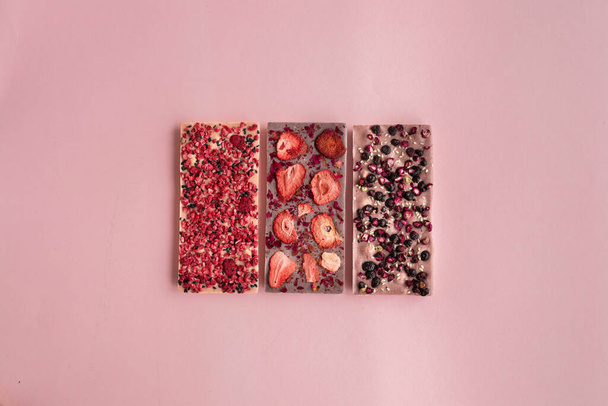 3 types of chokolate bar - raw dessert with dry berries - Photo, Image