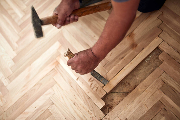 Repairman restoring old parquet hardwood floor. - Photo, Image