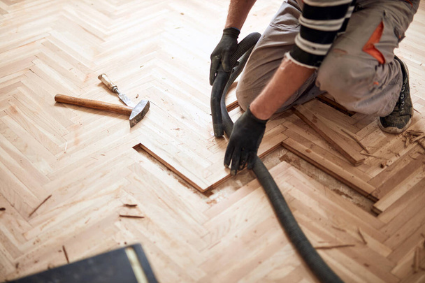 Repairman restoring old parquet hardwood floor. - Photo, Image