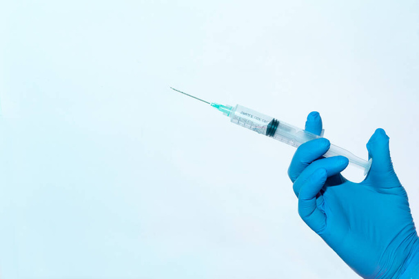 hand holding a syringe - Photo, Image