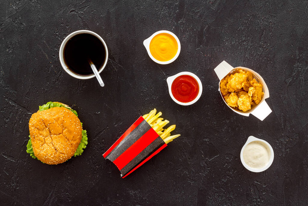 Layout of junk food - french fries burger and chicken nuggets - 写真・画像