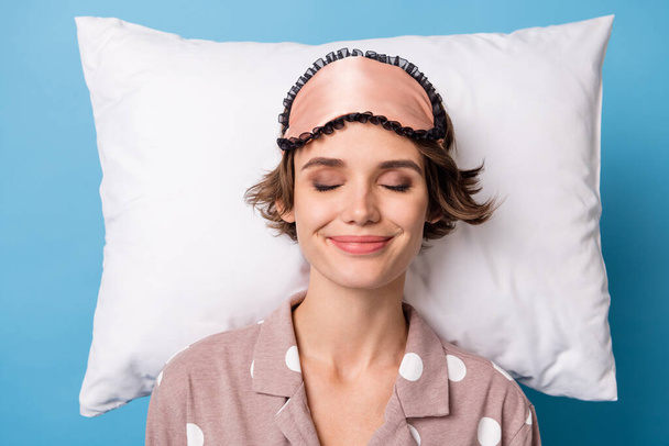 Top above high angle view photo of young girl happy positive smile sleep pillow bedroom isolated over blue color background - 写真・画像