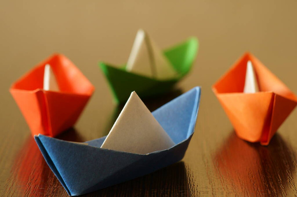 A group of colorful paper boats. - Zdjęcie, obraz