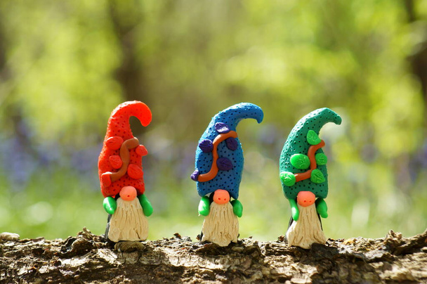 Figurines of three colorful dwarfs made of plasticine. - Photo, Image