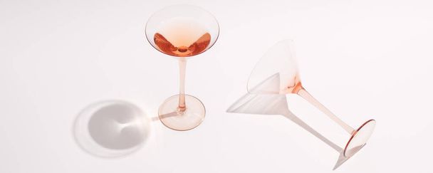 Rose wine in cocktail rose glasses on white background - Photo, image