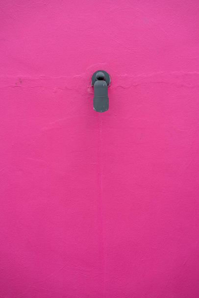 Black outdoor lamp on pink wall with copy space - Valokuva, kuva