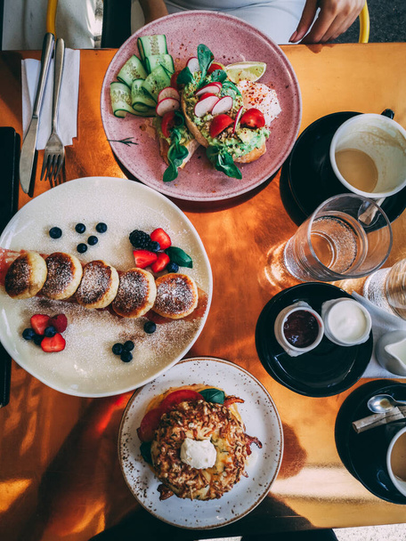 A vertical shot of a breakfast table with delicious food - Foto, Imagem