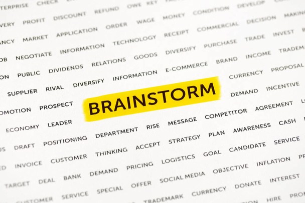 The word "Brainstorm" is highlighted with a marker on paper. Business concept, strategy, planning, success - Foto, afbeelding