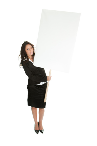 Cheerful businesswomen presenting empty board - Valokuva, kuva