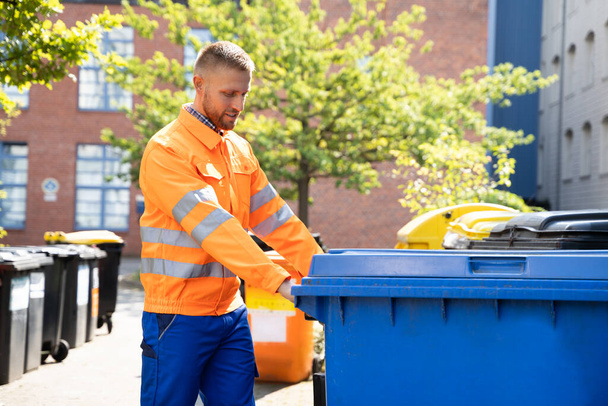 Garbage Removal Man Doing Trash And Rubbish Collection - Foto, Bild