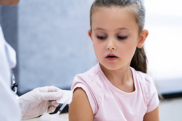 Kid Corona Virus Vaccine Injection. Covid-19 Child Immunization - Photo, image