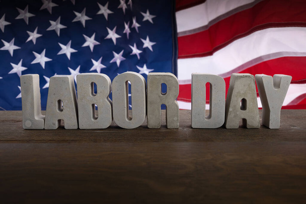 Happy Labor Day banner. USA flag and letters on rustic wooden background. - Photo, Image