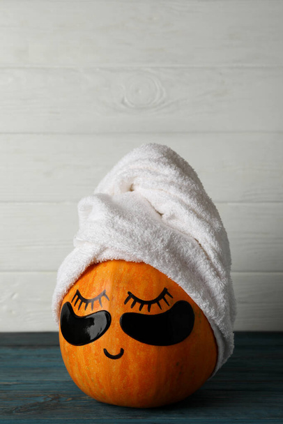 Spa concept with pumpkin on wooden background - Photo, Image