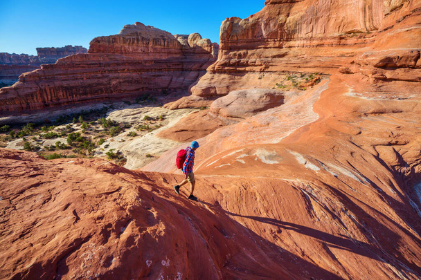 Hike in the Utah mountains. Hiking in unusual natural landscapes. Fantastic forms sandstone formations. - Photo, Image