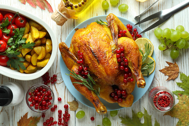Thanksgiving Day roast turkey concept on white wooden table - 写真・画像