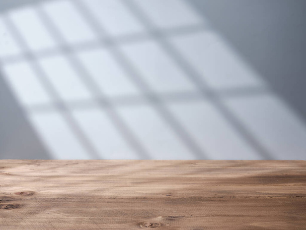 Empty wooden table top with light from the window - Valokuva, kuva