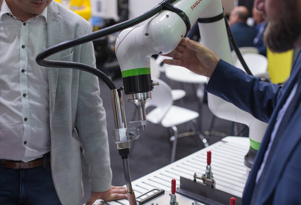 Poznan, Poland 06 Aug 2021: Fanuc robot CRX-10iA , collaborative robots, close-up. Robot arm in technology process, automatic industrial robot. ITM Industry Europe, HIGH TECH-EXPO. - Foto, Imagem