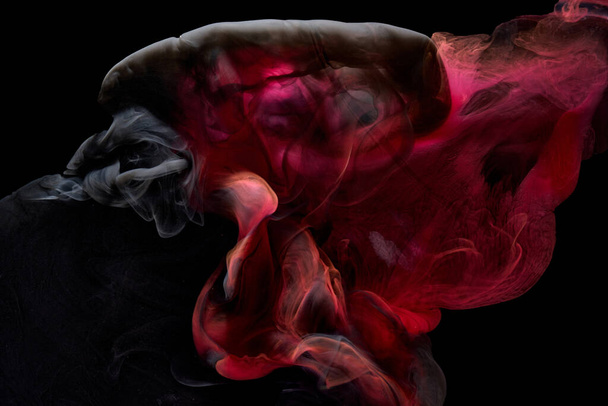 Red black pigment swirling ink abstract background, liquid smoke paint underwater - Φωτογραφία, εικόνα