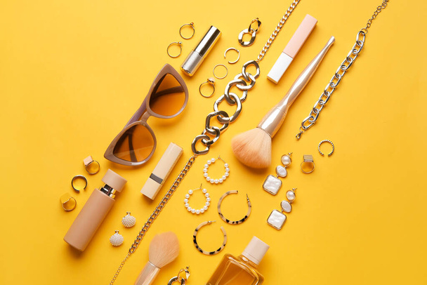 Set of female accessories and cosmetics on color background - Photo, image