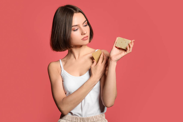 Beautiful young woman with soap on color background - Fotografie, Obrázek