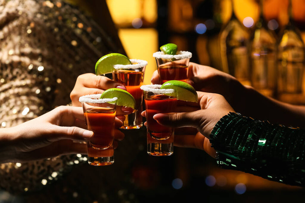 Women with shots of tasty tequila in bar, closeup - Zdjęcie, obraz
