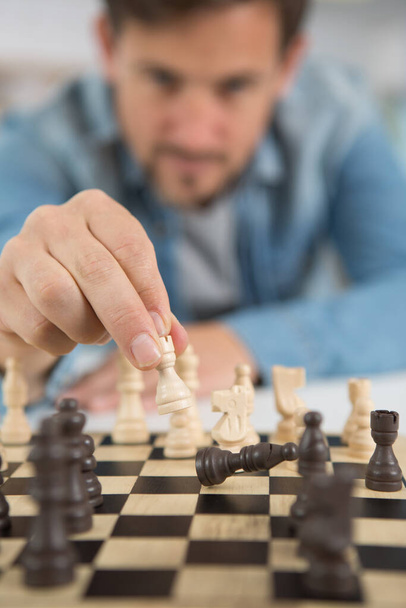 young man playing chess - Photo, image