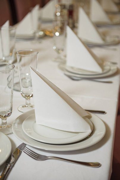 An elegant table set up in a wedding reception - Фото, изображение