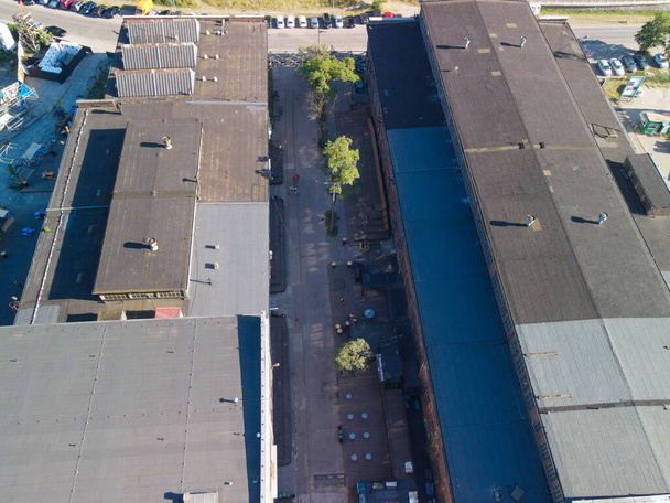 GDA, POLAND - Jun 13, 2021: An aerial shop industrial building roofs in Gdansk by Baltic sea in Poland - Фото, зображення