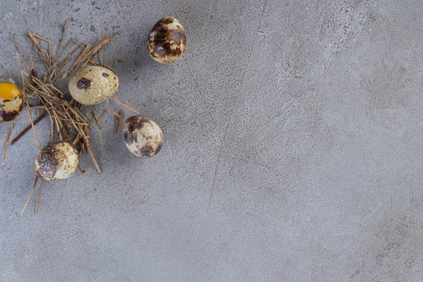Raw fresh quail eggs placed on a stone background. High quality photo - Valokuva, kuva