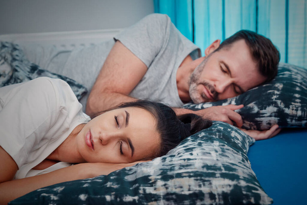 Young couple sleeping in bed. Healthy sleep concept - Фото, зображення