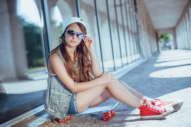 Teen girl with skateboard - Fotó, kép