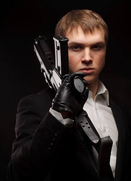 Man with gun - Foto, afbeelding