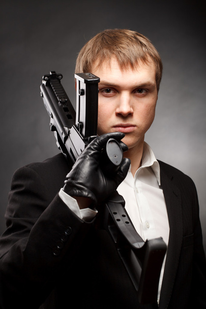 Man with gun - Foto, afbeelding