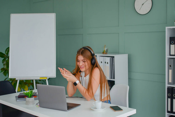 successful business woman working at her computer in the office. freelancer online learning concept - Фото, зображення