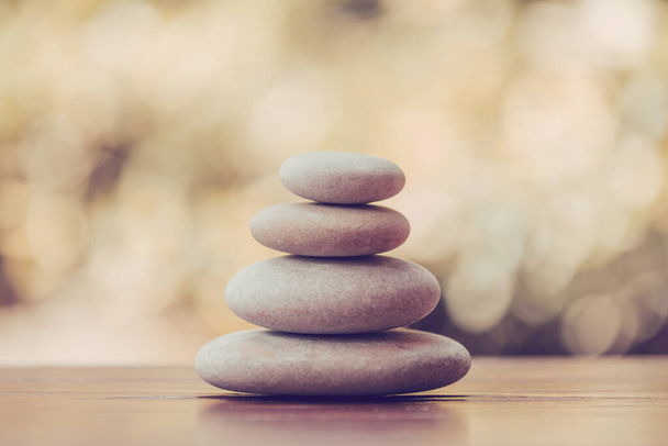 balancing pile of pebble stones, like ZEN stone, outdoor in springtime, spa wellness tranquil scene concept, soul equanimity mental calmness picture - Foto, Imagem