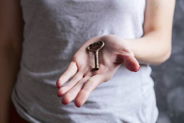 young girl holding old keys - Fotó, kép