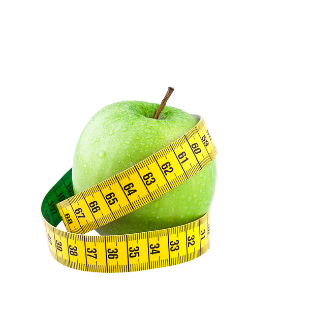 Healthy food and diet concept, green apple with measure tape - Zdjęcie, obraz