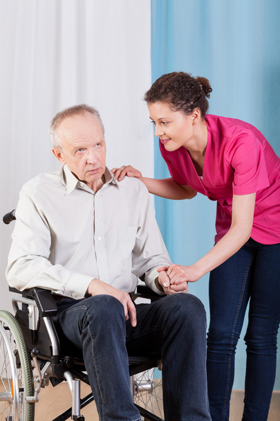Nurse caring about disabled man - Fotó, kép