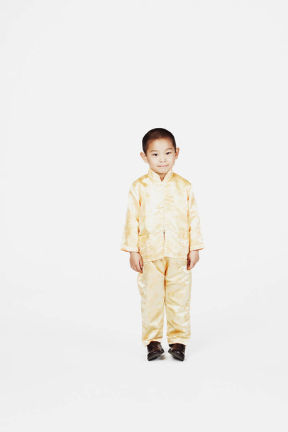 portrait of a cute little boy in a suit on a white background - Photo, Image