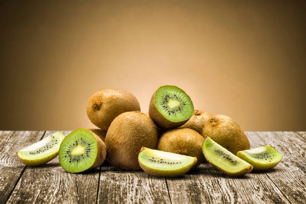 fresh kiwi fruit on wooden background - Fotoğraf, Görsel